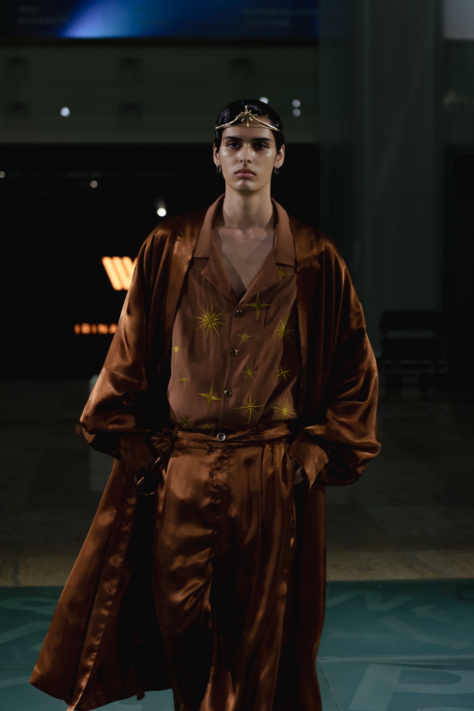 Akasha runway, bronze star-embroidered look with star crown