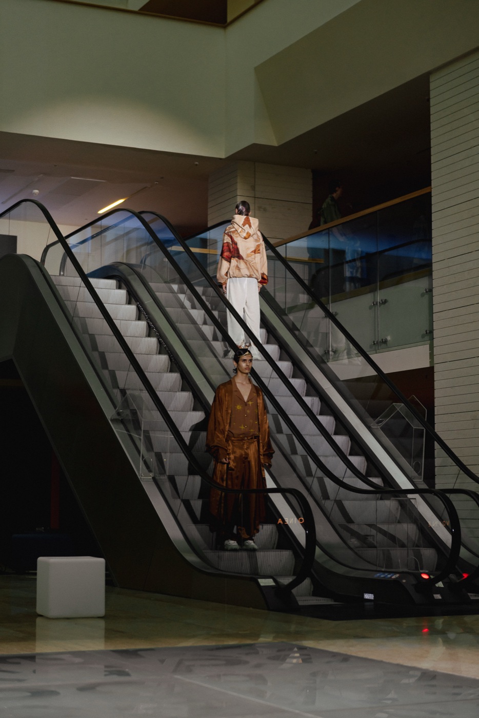 Akasha backstage, escalator with marble and bronze looks