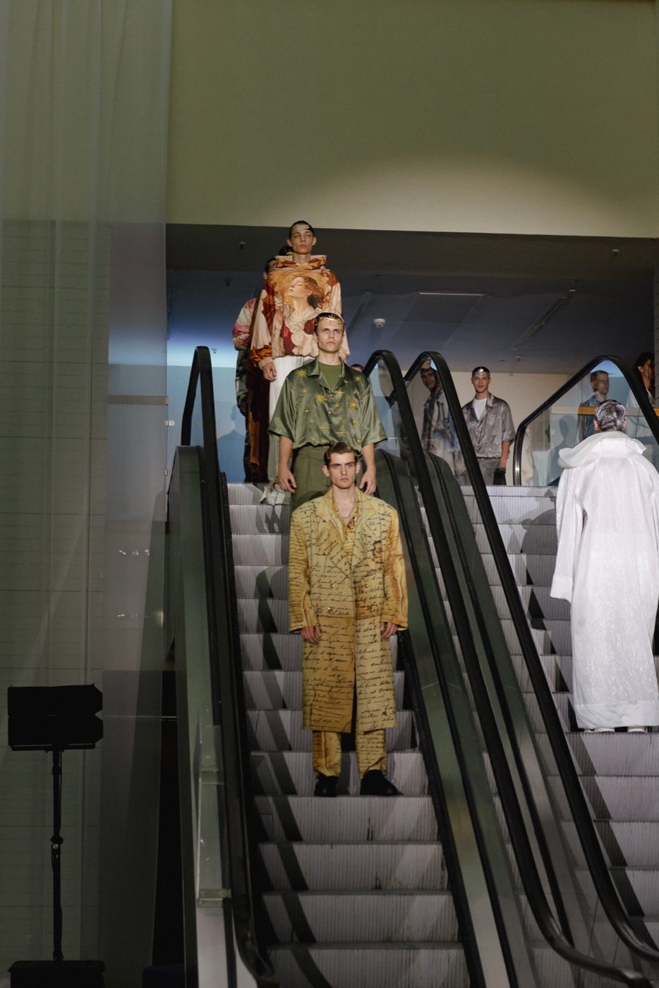 Akasha backstage, group descending escalator