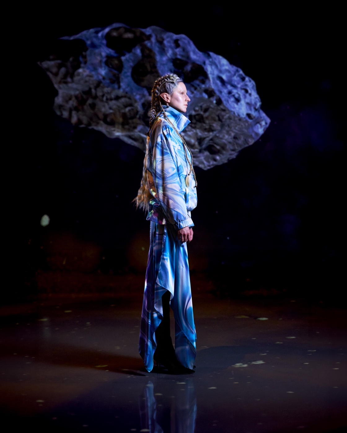 Origin campaign, blue floral coat against asteroid