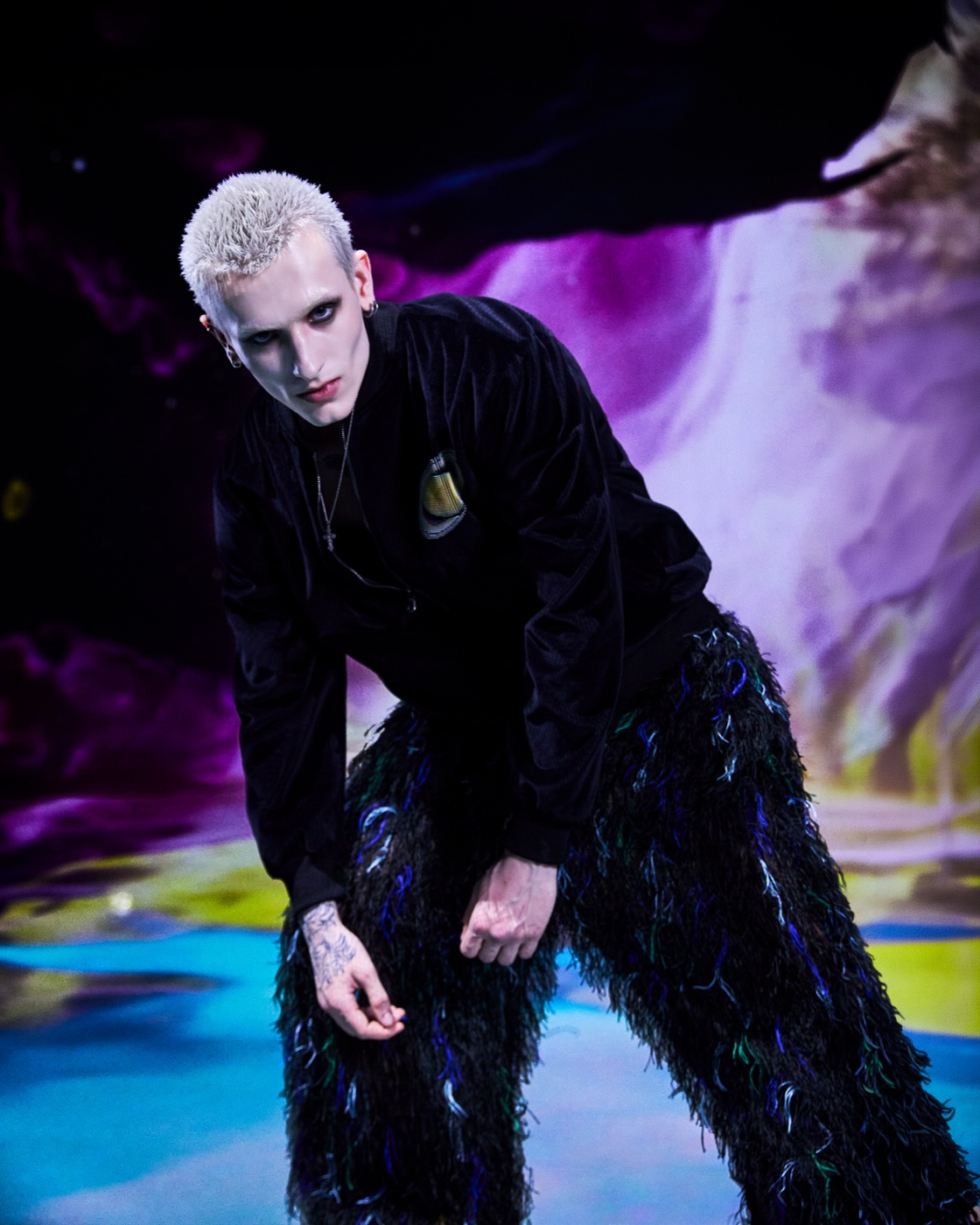 Origin campaign, feathered trousers against colourful smoke