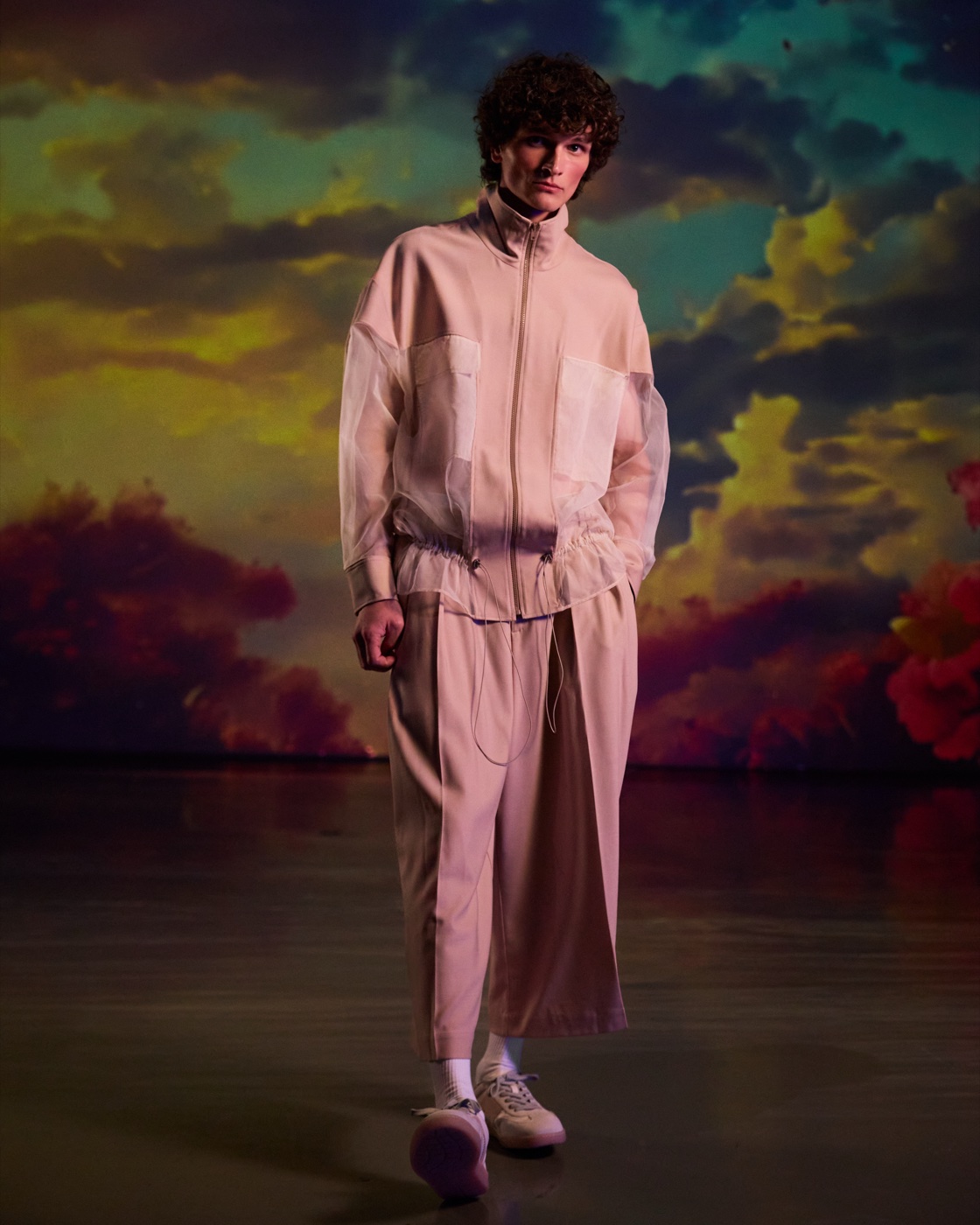 Origin campaign, beige tracksuit against sunset sky