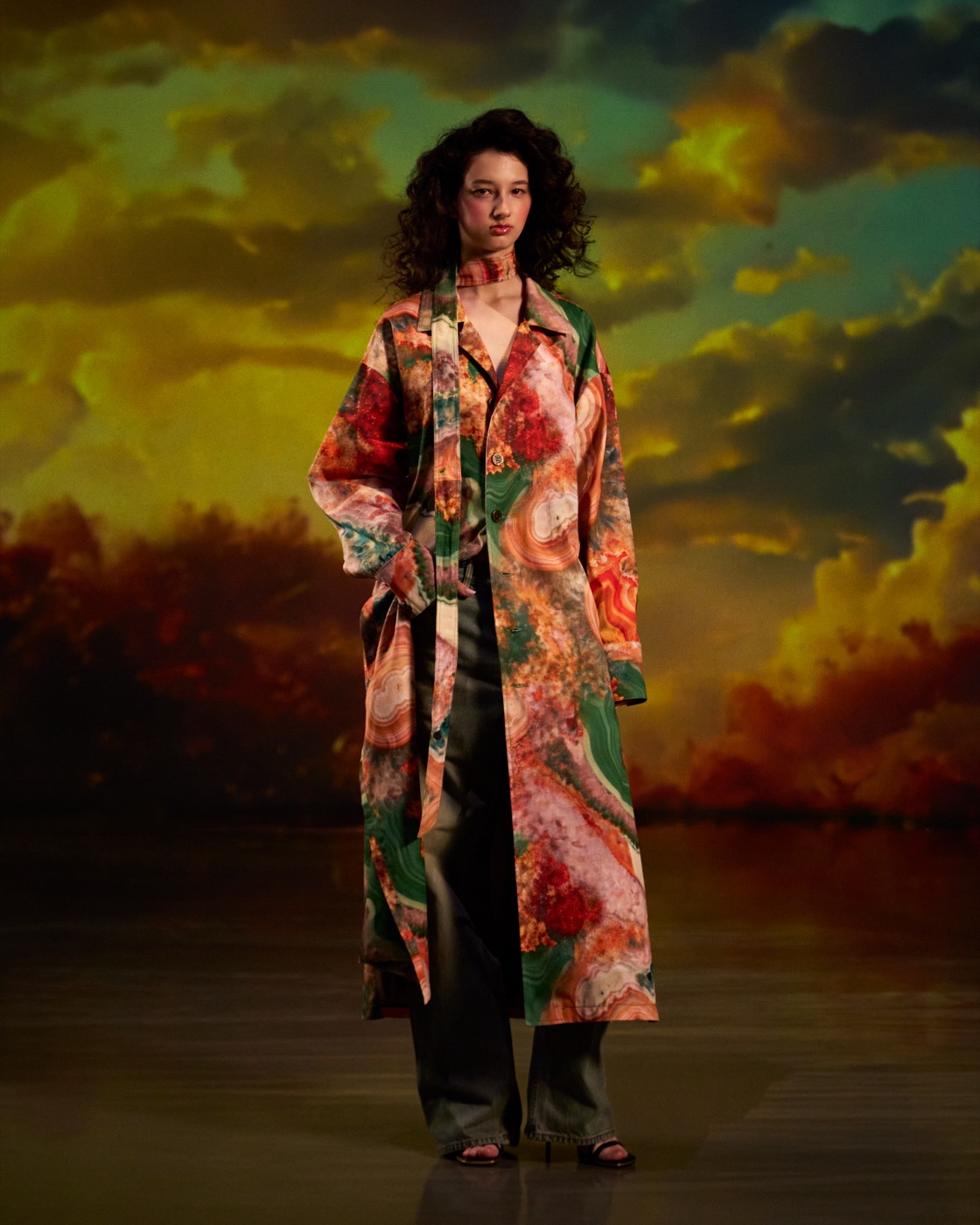 Origin campaign, tropical floral coat against sunset sky