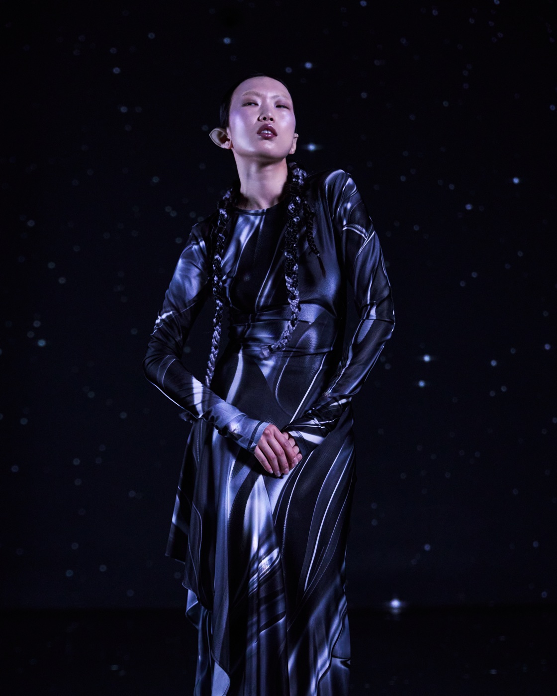 Origin campaign, moon-textured gown under starry sky